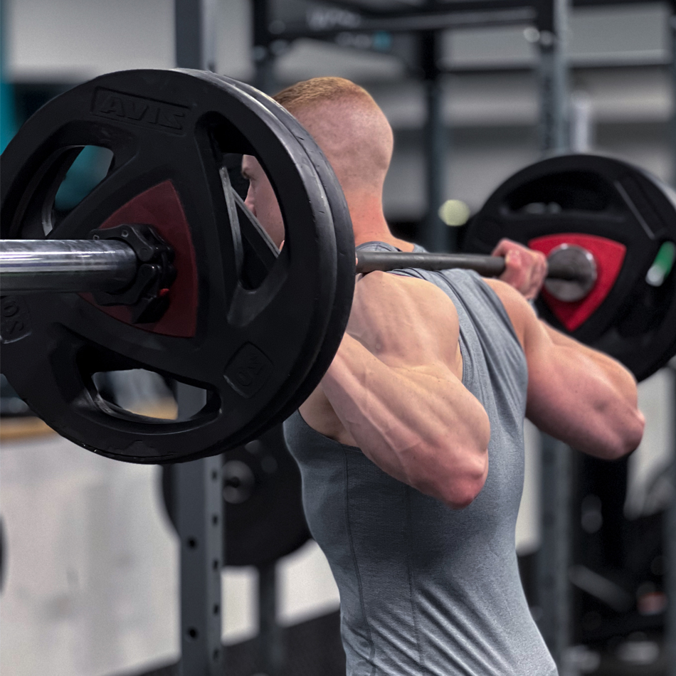 About Leon Coupe 3 Leon Coupe performing a barbell back squat as part of his powerbuilding training